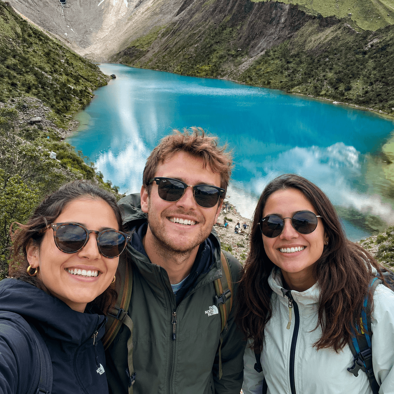 Travelers visiting Humantay Lake